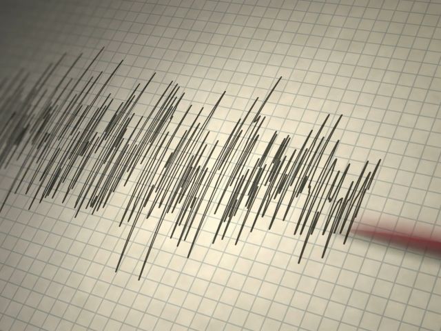Ein Seismograf zeichnet Kurven auf.