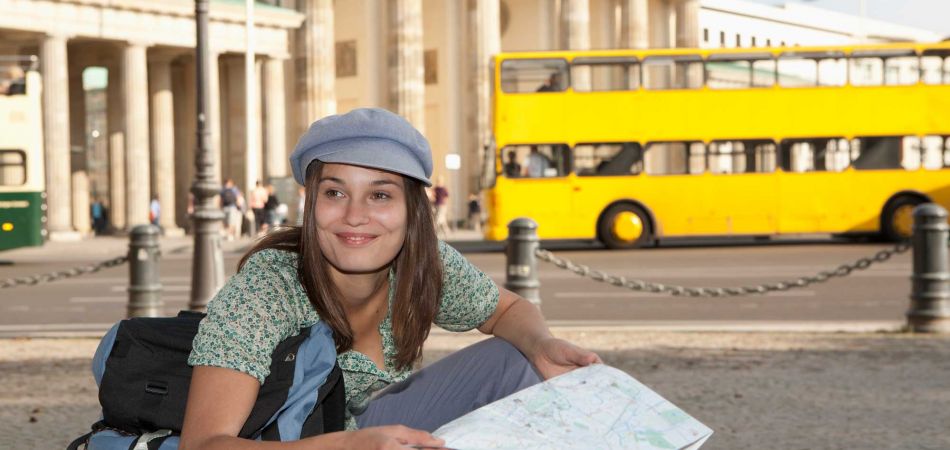 Tourist looking at Berlin city map Tourist looking at Berlin city map
