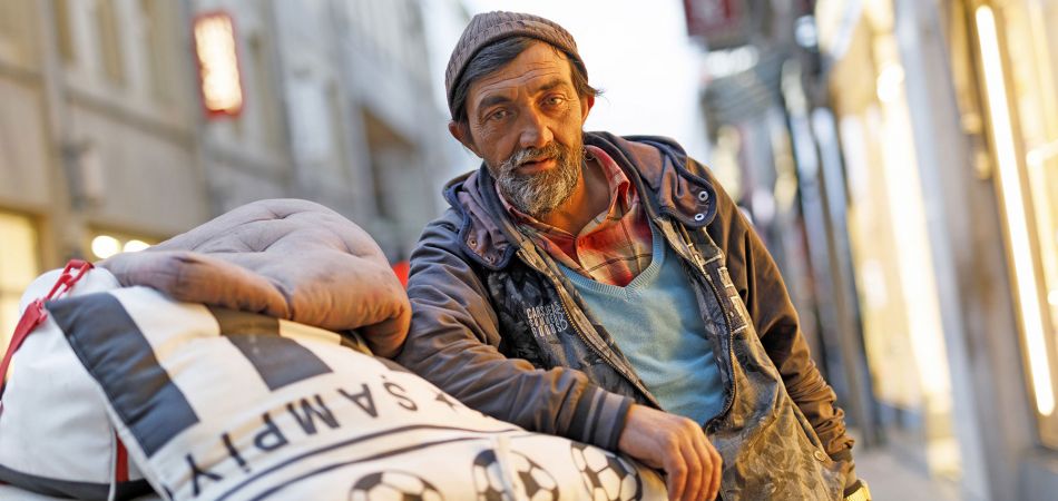 A homeless man in the streets of Cologne, Germany. A homeless man in the streets of Cologne, Germany.