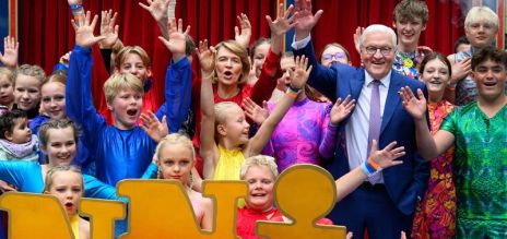 President Frank-Walter Steinmeier and his wife Elke Büdenbender stand with young artistes from the Giovanni Children’s Circus from Hanover in the grounds of Bellevue Palace at this year’s Citizens Festival.  