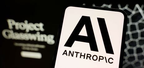 Anthropic’s logo can be seen on a smartphone with the Project Glasswing website in the background 