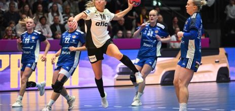 Jenny Behrend (Germany) rises to shoot. 