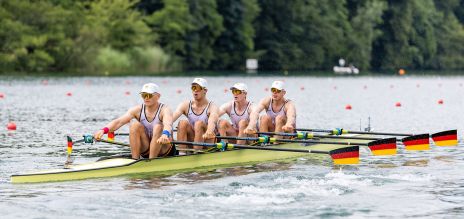 Four men rowing in a boat