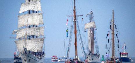 Sailing ships passing through the sea canal in Rostock-Warnemünde.