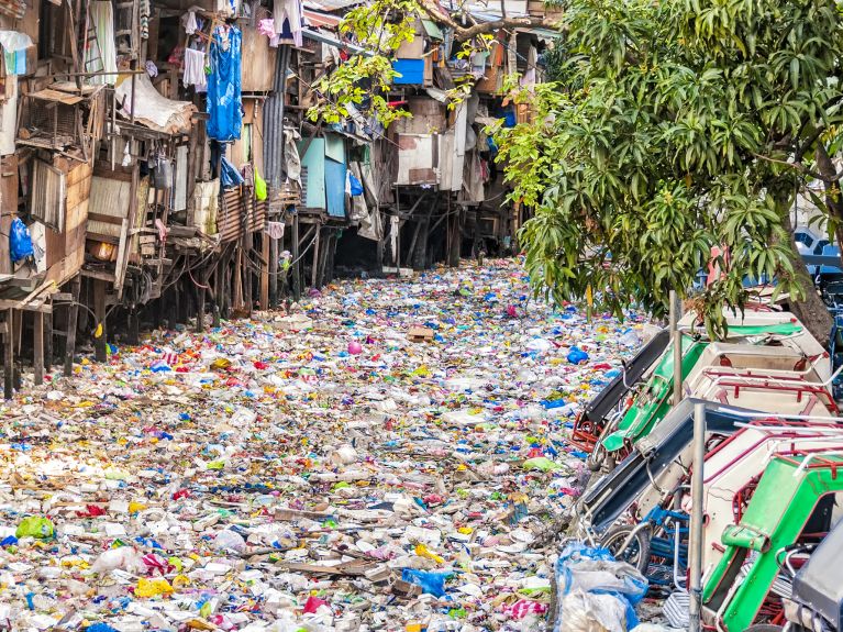 A river in Asia polluted with plastic waste A river in Asia polluted with plastic waste