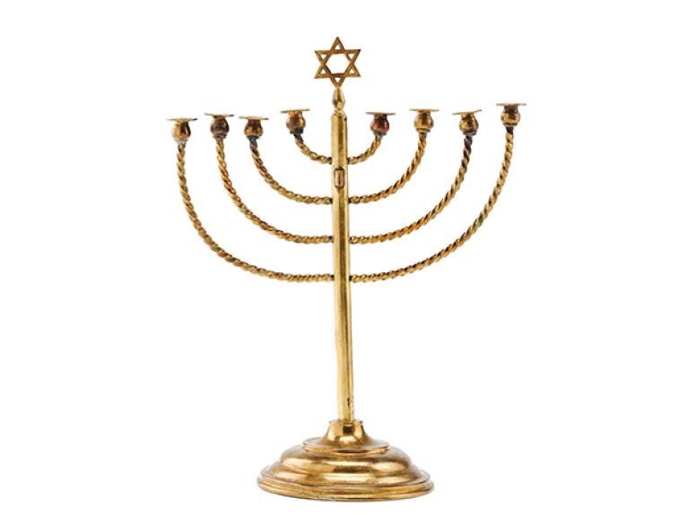 A Hanukkah menorah that belonged to the Posner family from Kiel. The menorah is pictured on the iconic photograph that Rosi Posner took on Hanukkah in 1931. In June 1933, Arthur and Rosi Posner fled from Germany with their three children.