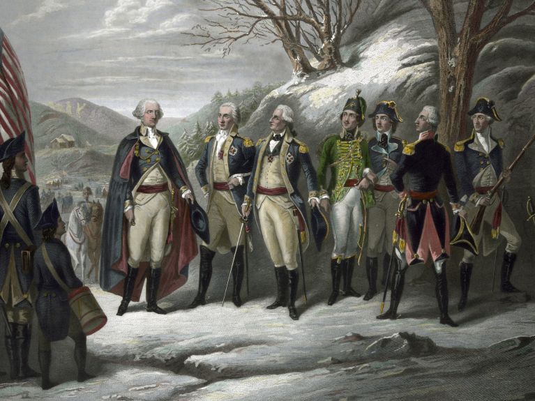 General George Washington (l.) mit seinen Offizieren, darunter Friedrich Wilhelm von Steuben und die ebenfalls deutschstämmigen Johann von Kalb und Peter Muhlenberg