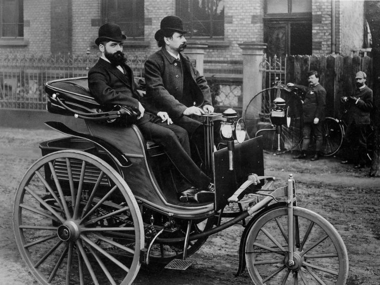Carl Benz at the wheel of the patent motor car he invented, 1887