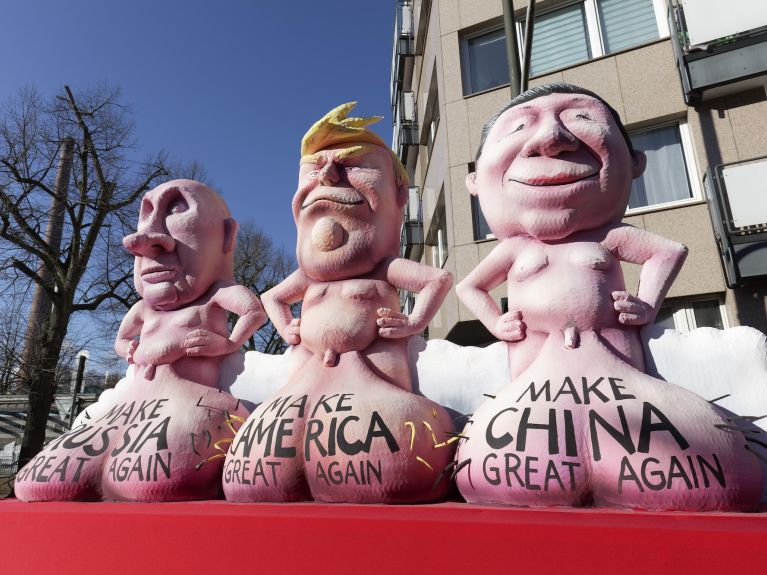 Exaggerated images: prominent politicians feature on a politically themed carnival float. 