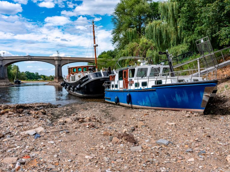 Boats stranded on the dry bed of the Rhine