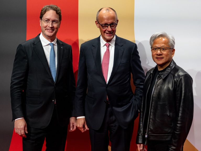 CEO of Mercedes-Benz, Ola Källenius, Federal Chancellor Friedrich Merz and CEO of Nvidia, Jensen Huang at the investment summit in Berlin