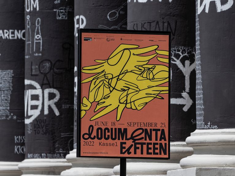 Poster in front of the pillars of the Fridericianum