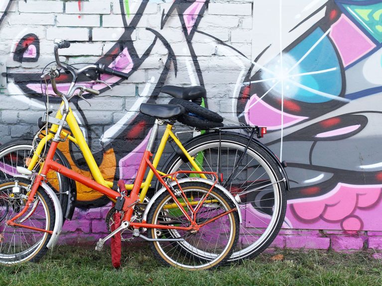  Travelling by bike allows you to get close to the remains of the Berlin Wall. 