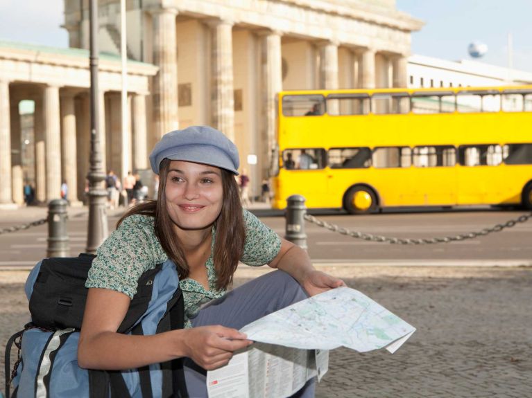 Tourist looking at Berlin city map