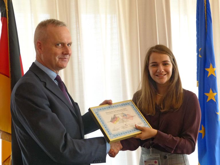 Deputy Chief of Mission at the German Embassy Boris Ruge and the winner Grace Frey