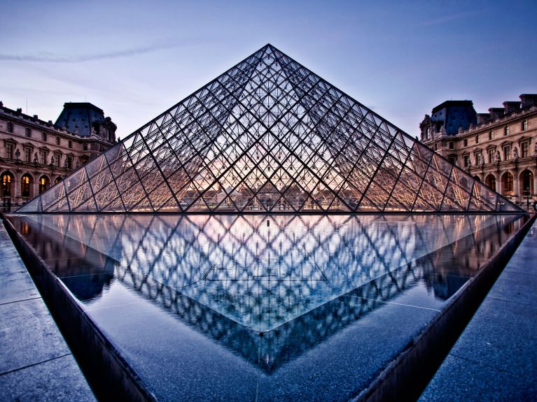 Damaged UFO? Ieoh Ming Pei’s glass pyramid in front of the Louvre in Paris, France