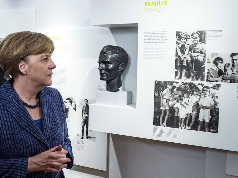 Merkel honors Hitler assassins, laments rise of far right 