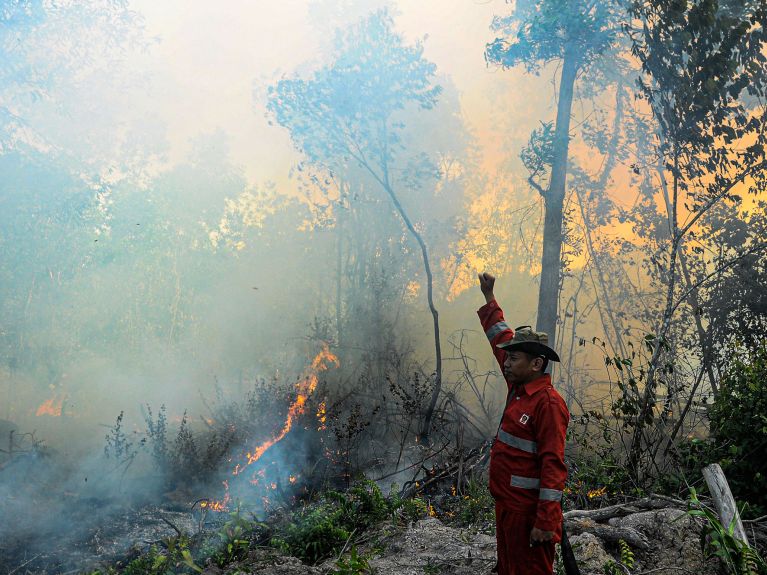 Indonesian firemen in action on Sumatra