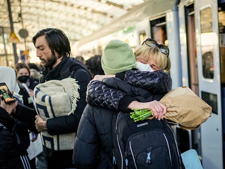 Olha Sidun (r) hugs her sister Hanna after her arrival at Berlin Central Station. Hanna Sidun fled the war in Ukraine and took three days to get from Kiev to Berlin.