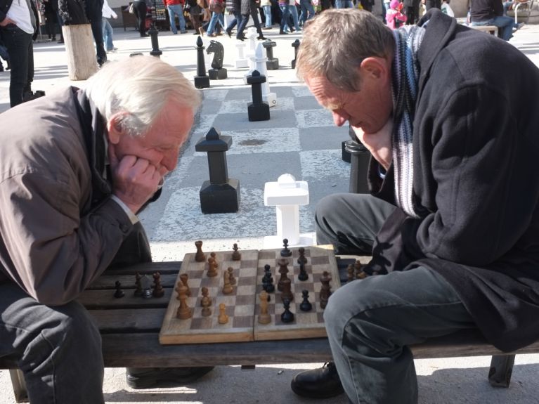 Financially secure: a pensioner playing chess in Salzburg