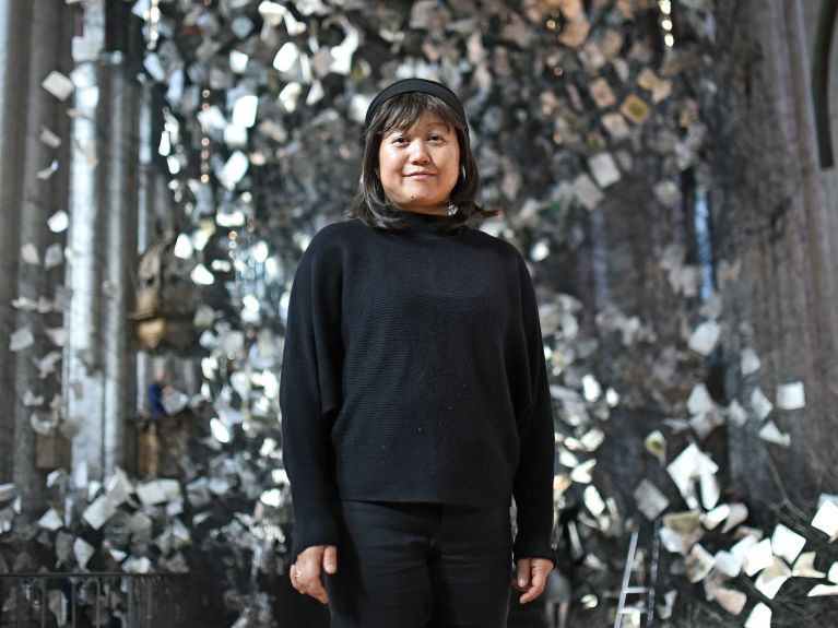 Chiharu Shiota in front of her installation “Lost Words”
