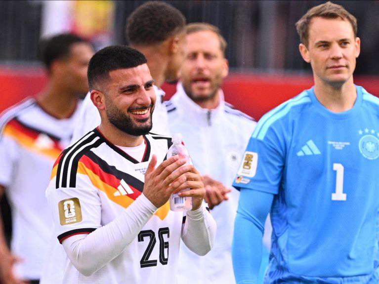 Forward Deniz Undav alongside goalkeeper Manuel Neuer