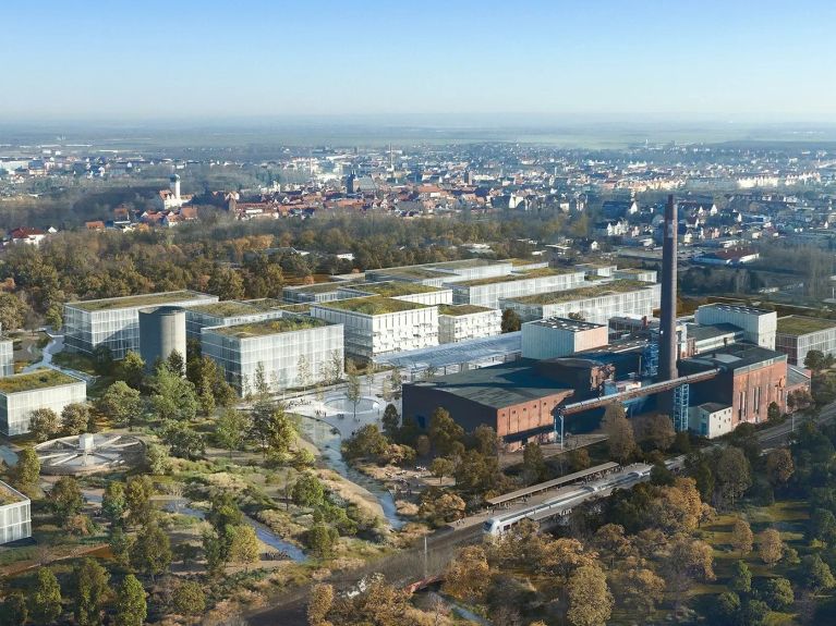 Vue sur une usine et simulation de nouveaux bâtiments  