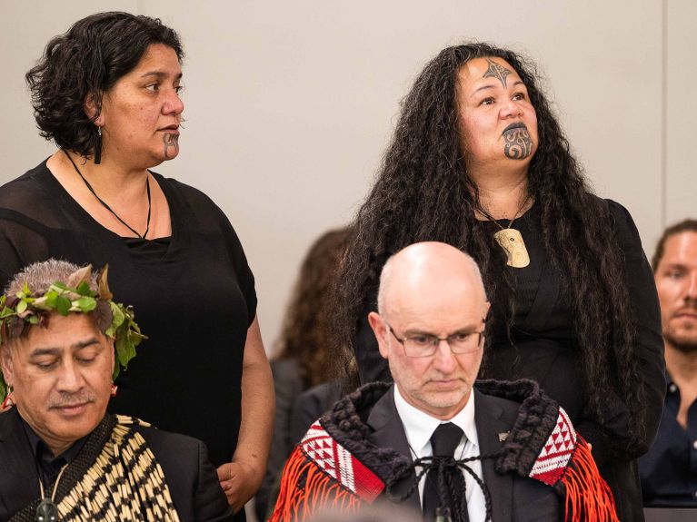 A choir sings at a ceremony to mark the return of bones to New Zealand from collections held by the University of Göttingen