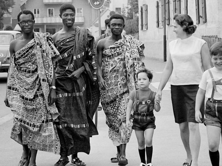 Language students from Ghana out and about in Murnau, Bavaria, with their host family, 1969