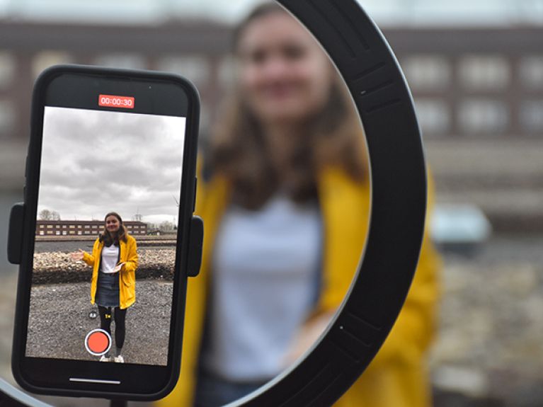 Marie making a TikTok video at Neuengamme.