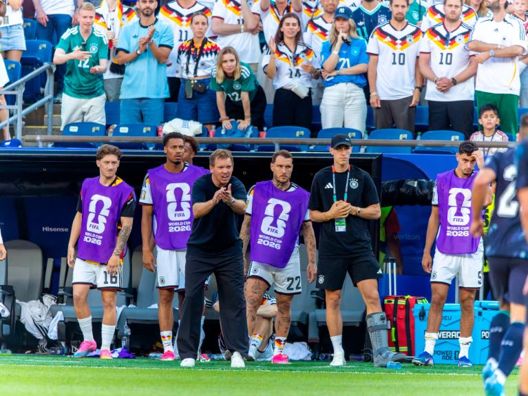 Germany head coach Julian Nagelsmann and substitutes on the touchline 