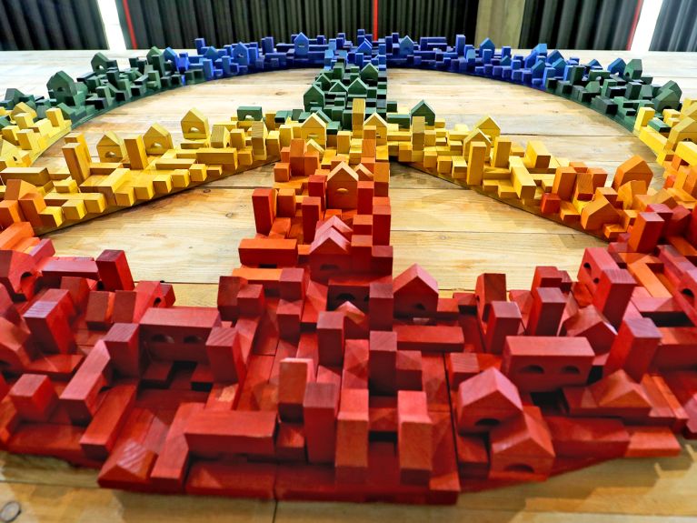 Peace signs made of wooden blocks: you have to work for peace.
