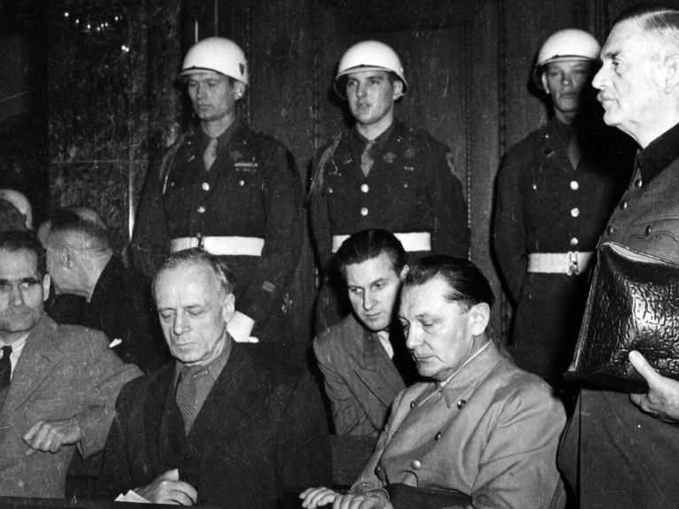 Four of the main defendants (from the left): Rudolf Hess, Joachim von Ribbentrop, Hermann Göring, Wilhelm Keitel (standing) 