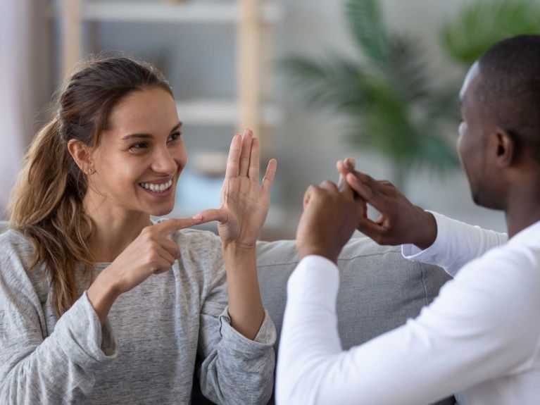 Two deaf people have a conversation.