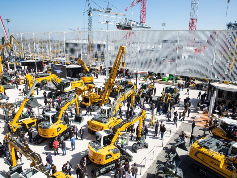 Trade fair in Munich: exhibition of construction machinery and cranes.