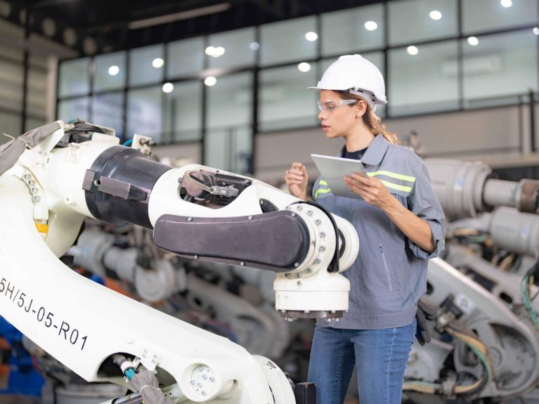 Robot on automated production line.  