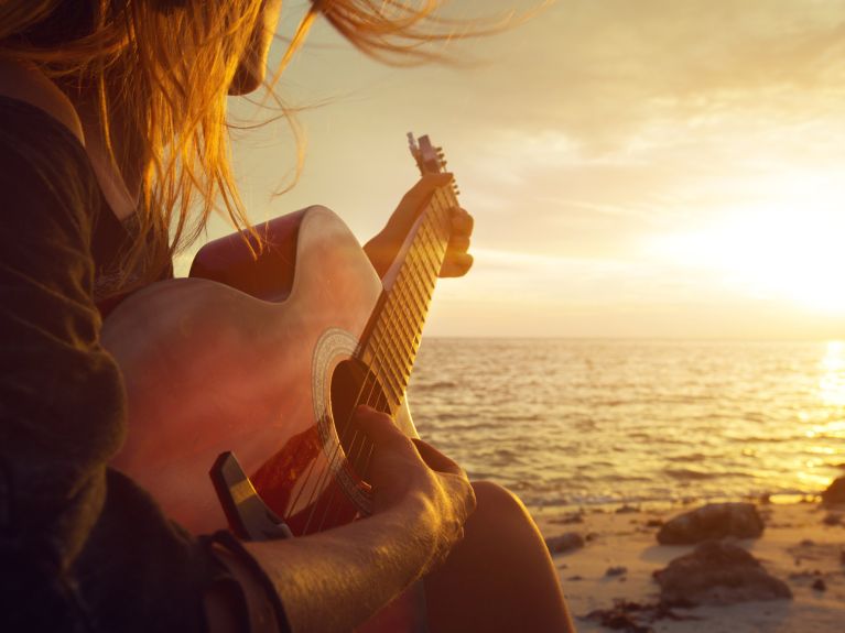 Dreamy sounds: The sound of a guitar, plus the whistling of wind and the burbling of water. 
