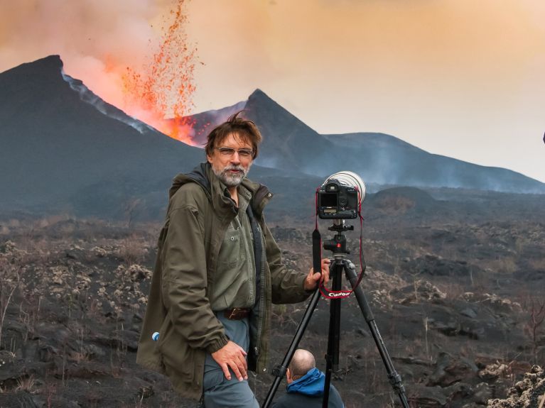Reinhard Radke filming on the Nyamuragira volcano in the Democratic Republic of Congo in 2012. 