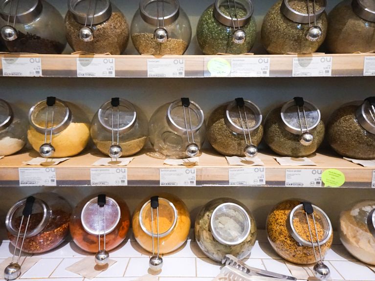 Spices and tea are stored in screw-top jars.