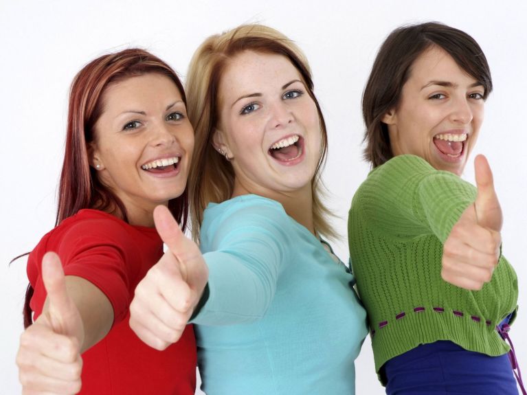 Three girls thumbs up Three girls thumbs up