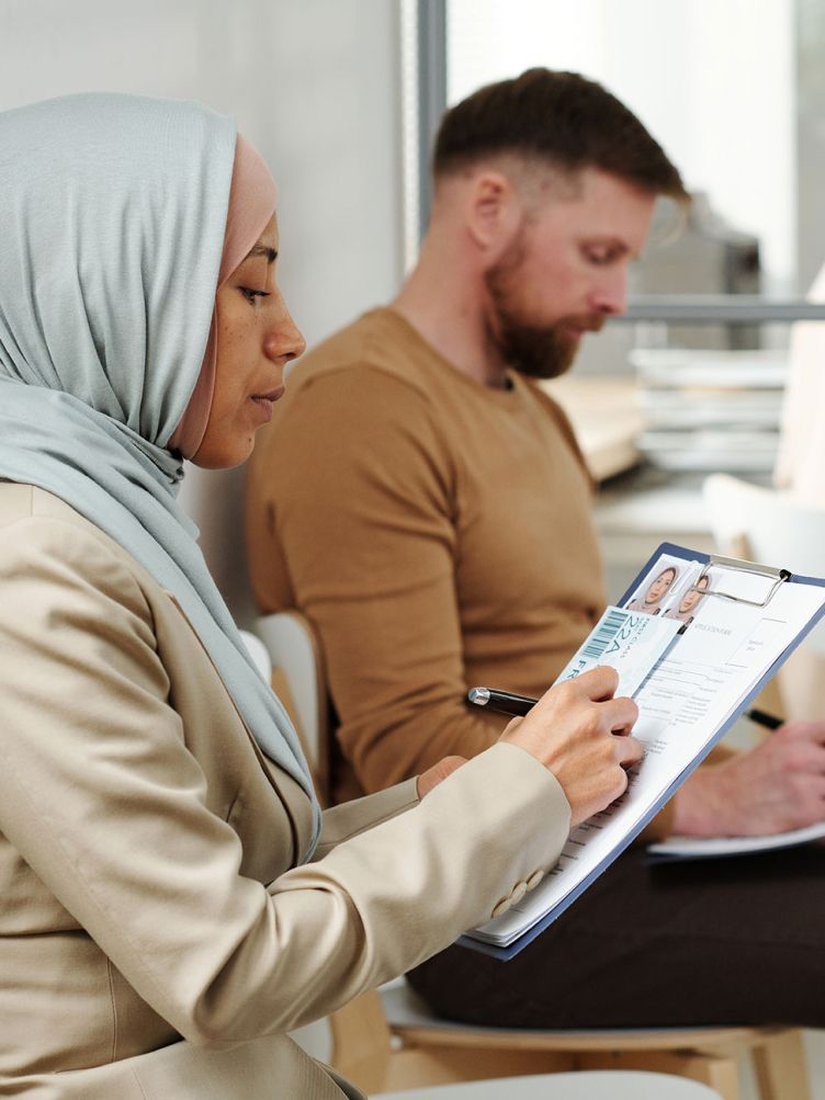 People waiting outside a consular office