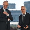Friedrich Merz und Mark Carney (r.) 