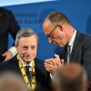Mario Draghi (l.) und Friedrich Merz