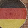 Dinner plate with the flag of Germany on it.