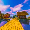 Ein Haus am See in der pixeligen Minecraft-Welt 