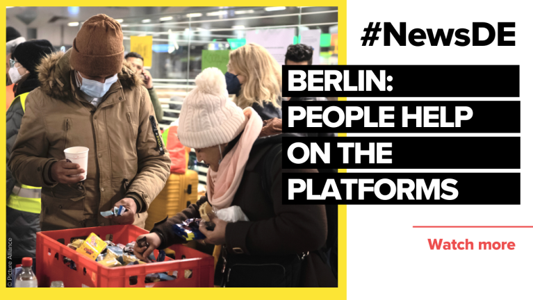 People in Berlin help Ukrainians on the train platforms